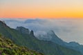 Sunset over the mountains in the clouds Royalty Free Stock Photo