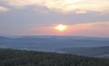 Sunset over mountains and countryside village, sky in soft pastel colors Royalty Free Stock Photo