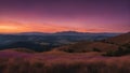 sunset over the mountains mountain landscape at sunset with purple and orange sky Royalty Free Stock Photo