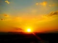 Sunset over the mountains in orange and yellow tones Royalty Free Stock Photo