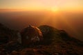 Sunset over mountains with a refuge