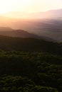 Sunset over mountains. Time-lapse of sun setting over the mountains. Sequence of clouds forming and dissipating near sunset Royalty Free Stock Photo