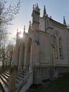 Sunset over neo romantic chaple in the woods Royalty Free Stock Photo