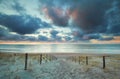 Sunset over North sea beach and sand path on dunes Royalty Free Stock Photo