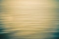 Sunset over the ocean abstract background. Water surface, soft yellow and turquoise colors Royalty Free Stock Photo