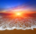 Sunset over ocean beach Royalty Free Stock Photo