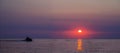 Sunset over ocean with jetski. silhouette of a man on a jet ski in the sun. Jet Ski at Sunset