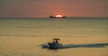 Boat and wake Sunset over the ocean Curacao Views Royalty Free Stock Photo