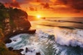 Sunset over the ocean with waves crashing on the cliffs. Bali, Indonesia, Seascape, ocean at sunset. Ocean coast with waves near