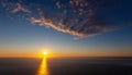 Sunset over ocean waves, withe clouds on the sky.