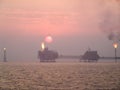 Sunset over oil complex in Persian Gulf