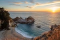Sunset over the Pacific Ocean and McWay Falls in Big Sur, California Royalty Free Stock Photo