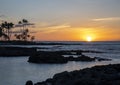 Sunset over the Pacific Ocean viewed from the shoreline of the Big Island, Hawaii. Royalty Free Stock Photo