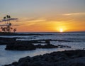 Sunset over the Pacific Ocean viewed from the shoreline of the Big Island, Hawaii. Royalty Free Stock Photo