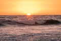 The Sun sets into the Pacific Ocean from a beach on the West Coast Royalty Free Stock Photo