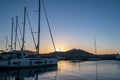 Sunset over Paros Greek island, Cyclades. Yacht and boat moored at port dock blue sky background Royalty Free Stock Photo