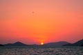 A stunning sunset over Phuket provides the backdrop to a traditional longtail boat, Phuket, Thailand Royalty Free Stock Photo