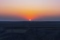 Sunset over plowed farm fields Royalty Free Stock Photo
