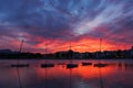 Sunset over Port de Alcudia with boats floating on sea Royalty Free Stock Photo