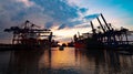 Sunset over the port of Hamburg - CITY OF HAMBURG, GERMANY - MAY 10, 2021 Royalty Free Stock Photo