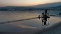 Sunset over the port with reflections on the water that bathes the pier