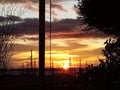 Sunset over Power Grid with Bursting Light Royalty Free Stock Photo