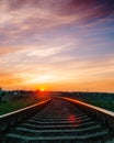 Sunset over railroad in sky with clouds Royalty Free Stock Photo