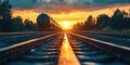 Sunset over railway tracks with freight train silhouette and vibrant sky Royalty Free Stock Photo