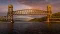 Sunset over the raised railway bridge over the Second Narrows, Vancouver, Canada Royalty Free Stock Photo