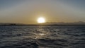 Sunset over the Red Sea. The sun is shining in the evening sky Royalty Free Stock Photo