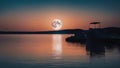 sunset over the river A blue moon over water, representing the calmness and the serenity of water. The moon is soft Royalty Free Stock Photo