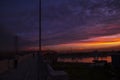 Sunset over the river in the city. The bridge crosses the river