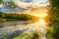 Sunset over the river in the forest Royalty Free Stock Photo