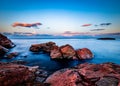 Sunset over rocks in the ocean in Canada Royalty Free Stock Photo
