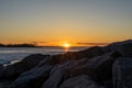 Sunset over rocks and water Royalty Free Stock Photo