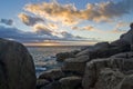 Sunset over rocky beach Royalty Free Stock Photo