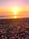 Sunset over a rocky beach Royalty Free Stock Photo