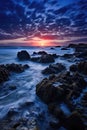 a sunset over a rocky beach Royalty Free Stock Photo