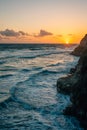 Sunset over rocky coast and the Pacific Ocean at Swami\'s Beach, in Encinitas, California Royalty Free Stock Photo