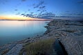 Sunset over rocky coastline