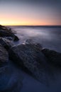 Sunset over rocky coastline Royalty Free Stock Photo