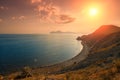 Sunset over rocky sea coast Royalty Free Stock Photo