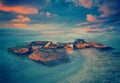 Sunset over rocky sea coast Royalty Free Stock Photo