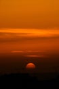 Sunset over rooftops and sea