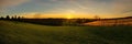 Sunset over rural farm tranquil meadow beauty Generative AI