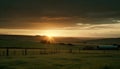 Sunset over rural farm, tranquil meadow beauty generated by AI Royalty Free Stock Photo