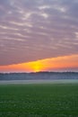 Sunset over rural field Royalty Free Stock Photo