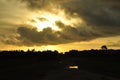 Sunset over rural landscape with dramatic clouds Royalty Free Stock Photo