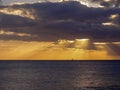 Sunset over a sailboat in Oahu