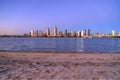 Sunset over the San Diego skyline across San Diego Bay from Coronado Island Royalty Free Stock Photo